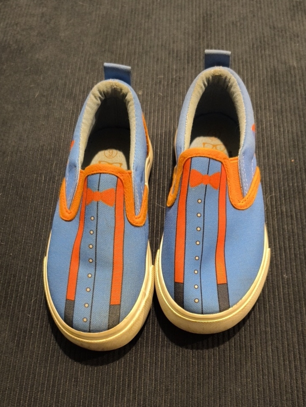 Kids Blue Slip-On Sneakers with Orange Bowtie Print